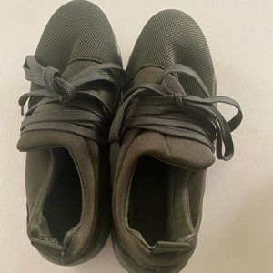 Size 7 1/2 Soft fabric khaki green colored pull on tennis shoes w/ tie strings.